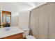 Bathroom featuring a wood vanity, toilet and shower at 4427 W Powell Dr, New River, AZ 85087