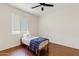 Bedroom featuring a hardwood floor and a window at 4427 W Powell Dr, New River, AZ 85087