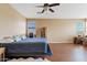 Spacious bedroom with hardwood floors, and a large window at 4427 W Powell Dr, New River, AZ 85087