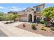 Charming two-story home with arched entryway, desert landscaping and two-car garage at 4427 W Powell Dr, New River, AZ 85087