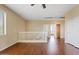 Open-concept living room with wood floors and ample natural light at 4427 W Powell Dr, New River, AZ 85087