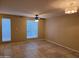 Spacious bedroom showcasing neutral walls, tile floors, and large windows that offer plenty of natural light at 4615 N 39Th Ave # 21, Phoenix, AZ 85019