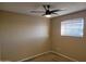 Bedroom featuring neutral walls, carpet and a window with blinds, and a ceiling fan at 4615 N 39Th Ave # 21, Phoenix, AZ 85019