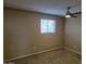 Bedroom featuring neutral walls, carpet and a window with blinds, and a ceiling fan at 4615 N 39Th Ave # 21, Phoenix, AZ 85019