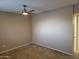 Bedroom featuring neutral walls, carpet and a ceiling fan with an attached bathroom at 4615 N 39Th Ave # 21, Phoenix, AZ 85019