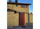 View of the home's facade, featuring a private gate and a charming, secure courtyard entrance at 4615 N 39Th Ave # 21, Phoenix, AZ 85019