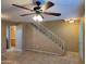 Open-concept living room highlighting tile floors, stairs with white banisters, and great natural light at 4615 N 39Th Ave # 21, Phoenix, AZ 85019