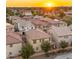 Neighborhood aerial view capturing a beautiful sunset over the homes, landscape and surrounding community at 4656 E Beck Ln, Phoenix, AZ 85032
