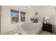 Cozy bedroom features a bed, two windows with coverings, and neutral walls, creating a tranquil and inviting space at 4656 E Beck Ln, Phoenix, AZ 85032