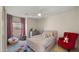 Charming ' bedroom with a playful, stylish décor featuring colorful accents and a cozy reading chair at 4656 E Beck Ln, Phoenix, AZ 85032