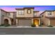 Charming two-story home with a two-car garage and well-maintained landscaping at dusk at 4656 E Beck Ln, Phoenix, AZ 85032