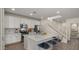 Bright kitchen with stainless steel appliances, large island, and white cabinetry at 4656 E Beck Ln, Phoenix, AZ 85032