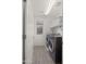 Well-lit laundry room includes a washer and dryer, along with shelving and neutral walls, offering convenience at 4656 E Beck Ln, Phoenix, AZ 85032