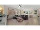 Open-concept living room with modern decor and natural light from large windows creates an inviting atmosphere at 4656 E Beck Ln, Phoenix, AZ 85032