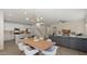 Open-concept living space combining the kitchen, dining area, and living room at 4656 E Beck Ln, Phoenix, AZ 85032