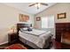 Bedroom with dark wood floors, a ceiling fan and a window for plenty of light at 481 S San Marcos Dr, Apache Junction, AZ 85120