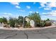 Corner lot featuring desert landscaping, mature trees, and charming curb appeal at 481 S San Marcos Dr, Apache Junction, AZ 85120
