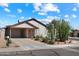 Charming single-story home featuring desert landscaping, a covered carport, and a welcoming facade at 481 S San Marcos Dr, Apache Junction, AZ 85120