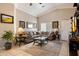 Bright living room with tile floors, a comfortable sofa, and classic decor at 481 S San Marcos Dr, Apache Junction, AZ 85120
