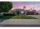 Well-maintained home featuring desert landscaping, ample parking, and a two-car garage at 6707 E Beverly Ln, Scottsdale, AZ 85254