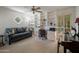 Inviting living room featuring a built in bookcase, desk, and a view of the outdoors at 6707 E Beverly Ln, Scottsdale, AZ 85254