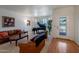 Spacious living room with natural light, plush furniture, and a beautiful grand piano at 6707 E Beverly Ln, Scottsdale, AZ 85254