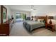 Comfortable main bedroom with access to the outdoor pool through sliding glass doors at 6707 E Beverly Ln, Scottsdale, AZ 85254