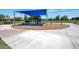 Outdoor playground with various playground equipment including slides, swings, and climbing structures at 6707 E Beverly Ln, Scottsdale, AZ 85254