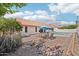 Backyard features a tile patio with a table, chairs, and a pool at 6719 W Kerry Ln, Glendale, AZ 85308