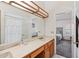 This bathroom features dual sink vanity, a large mirror and a doorway leading into a bedroom at 6719 W Kerry Ln, Glendale, AZ 85308