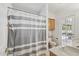 Neutral bathroom featuring a tub and shower combo and direct access to the back yard at 6719 W Kerry Ln, Glendale, AZ 85308