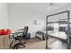 This is a minimalist bedroom with a ceiling fan and carpet flooring at 6719 W Kerry Ln, Glendale, AZ 85308