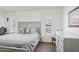 A calming main bedroom with plush carpet, soft gray walls, and stylish furniture at 6719 W Kerry Ln, Glendale, AZ 85308