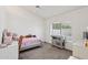 Bright bedroom offers a ceiling fan and a large window for natural light at 6719 W Kerry Ln, Glendale, AZ 85308