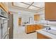 This bright kitchen features wood cabinets, stainless steel appliances and opens into a spacious living area at 6719 W Kerry Ln, Glendale, AZ 85308