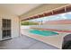 This covered patio offers a scenic view of the backyard pool at 6719 W Kerry Ln, Glendale, AZ 85308