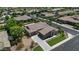 Aerial view of the home showcasing desert landscaping, a three-car garage, and a tile roof at 6917 E Ingram Cir, Mesa, AZ 85207