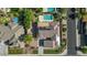 Overhead view of the property showing the pool, landscaping, solar panels, and three-car garage at 6917 E Ingram Cir, Mesa, AZ 85207