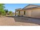 Charming backyard with desert landscaping, artificial grass, and covered patio area at 6917 E Ingram Cir, Mesa, AZ 85207