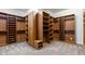 Large walk-in closet provides generous storage with custom shelving, drawers, and plush carpet at 6917 E Ingram Cir, Mesa, AZ 85207