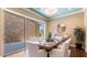 Elegant dining room with stylish furniture, decorative lighting, and a view to the outside patio at 6917 E Ingram Cir, Mesa, AZ 85207