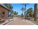 Entrance to a private, gated community with mature palm trees at 6917 E Ingram Cir, Mesa, AZ 85207
