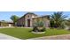Stunning home featuring a landscaped yard and a charming, welcoming facade at 6917 E Ingram Cir, Mesa, AZ 85207