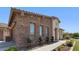 Elegant home with stone detailing, well-kept landscaping, and great curb appeal at 6917 E Ingram Cir, Mesa, AZ 85207