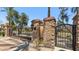 Close up of the community gate made of stone, brick and rod iron at 6917 E Ingram Cir, Mesa, AZ 85207