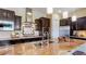 Modern kitchen featuring sleek stainless-steel appliances, custom cabinetry, and a functional island for gatherings at 6917 E Ingram Cir, Mesa, AZ 85207