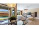Living room view through the glass doors with outdoor pool and well-manicured backyard at 6917 E Ingram Cir, Mesa, AZ 85207