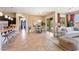 This bright living room and connected kitchen features a dining area, an open design, and views of the outdoors at 6917 E Ingram Cir, Mesa, AZ 85207