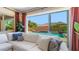 Bright living room with comfortable seating and large windows overlooking the pool area at 6917 E Ingram Cir, Mesa, AZ 85207