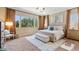 Spacious main bedroom with natural light, neutral tones, and comfortable furnishings at 6917 E Ingram Cir, Mesa, AZ 85207